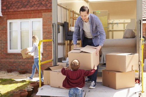 Professional local removals team handling boxes in Woodsidepark