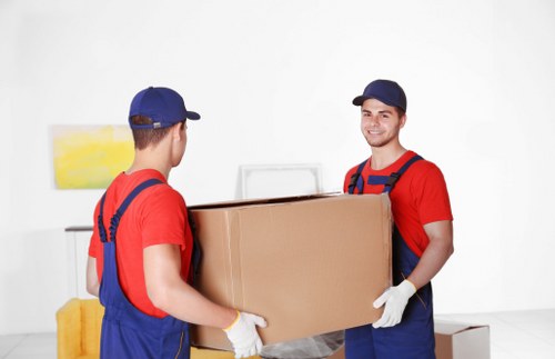 Professional packing services in Woodsidepark preparing household items for safe moving