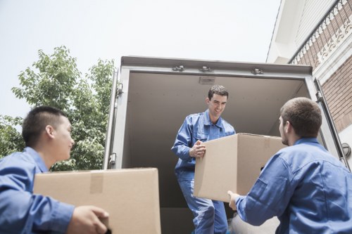 Mixed furniture and boxed items representing a load-based storage estimate